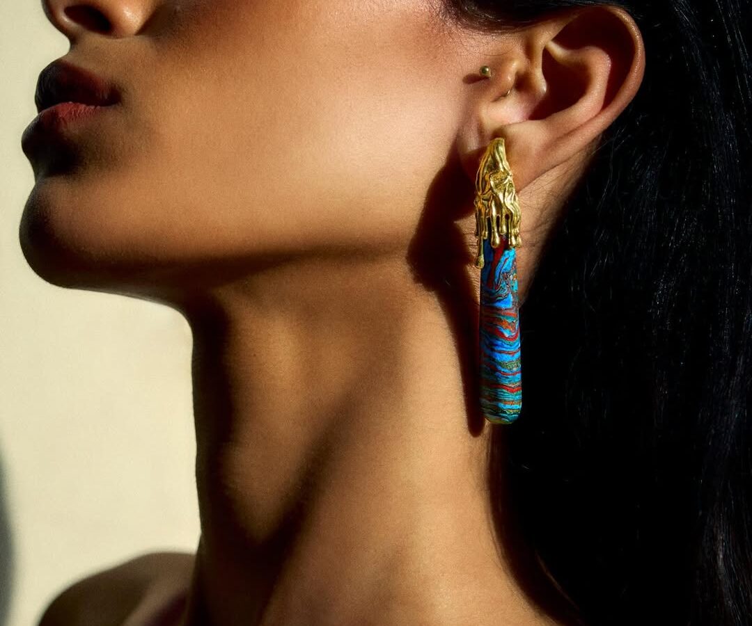 Woman wearing colourful earrings