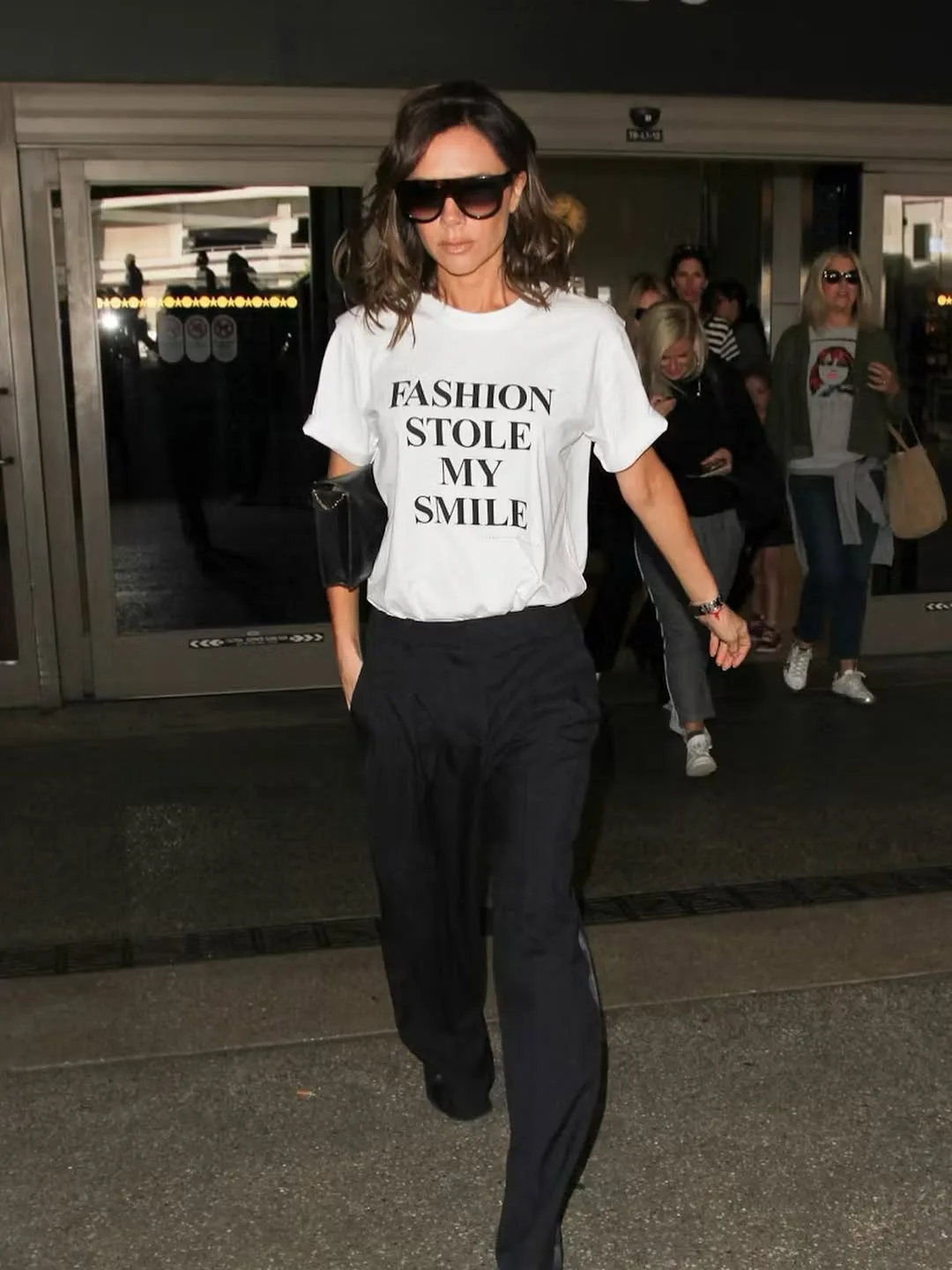 Victoria Beckham wearing a Fashion Stole my Smile t-shirt