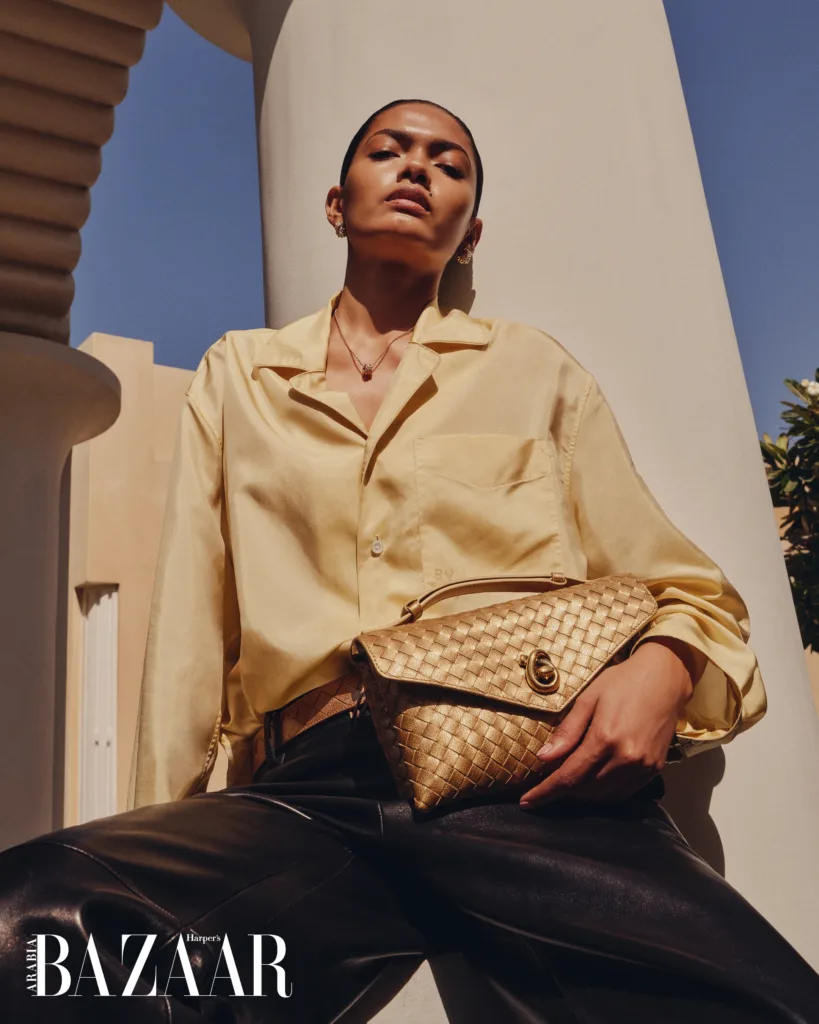 Bottega Veneta belted shirt, trousers, belt, bag, earrings, and pendant necklace 