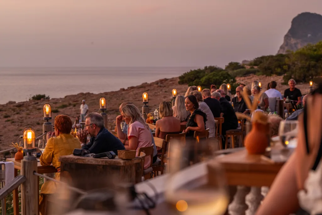 Diner's enjoy dinner on the restaurant's sunset terrace at Hostal la Torre